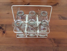 Small milk bottles in rack